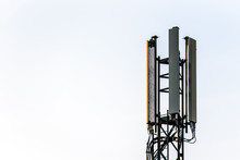 Mobile Network Operator Mast Over Cloudy Sky In Uk