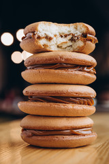 Poster - Close up Traditional chocolate and Pumpkin Whoopie pies filled made with vanilla cream cheese frosting cream