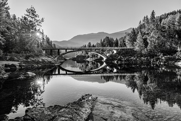 A sunrise across Belton Bridge over Middle Fork Flathead River near West Glacier in Glacier National Park, Montana, USA