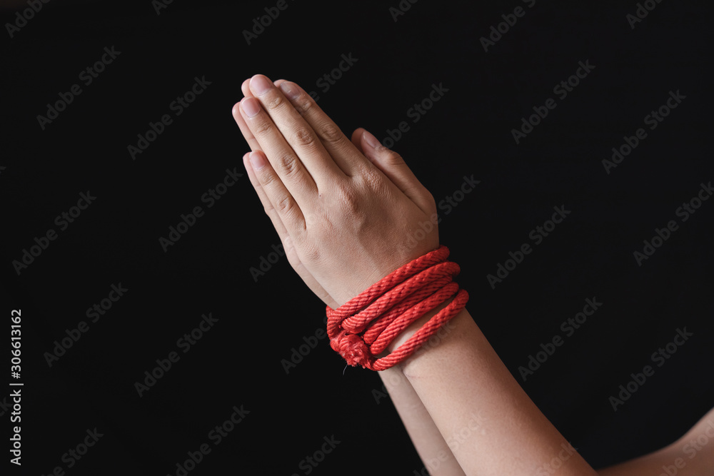human trafficking Concept.Hands tied up with rope of a missing ...