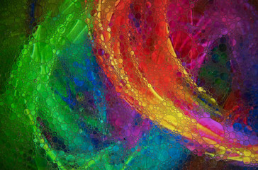 Mixing water and oil to form beautiful colorful abstract backgrounds 