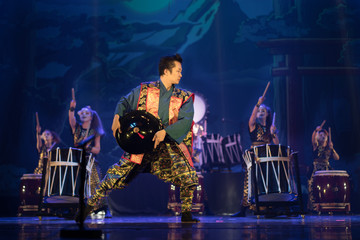 Traditional Japanese performance. Man in traditional kimono dancing on the stage.