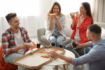 Wall Mural - Group of friends eating tasty pizza at home