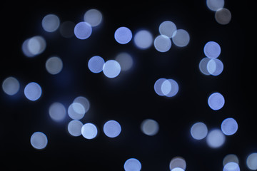 Defocused abstract blue christmas bokeh background copy space