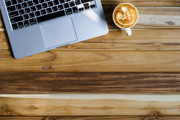 Wall Mural - Office desk table of modern workplace with laptop on wooden table, top view laptop background and copy space on wooden background,Flay lay, Top view office table desk with computer laptop,