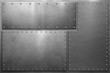 Metal plates with rivets on steel background