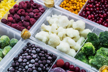 Wall Mural - frozen vegetables, fruits and berries in the shop window