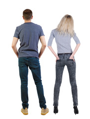 Poster - Back view of couple. beautiful friendly girl and guy together.