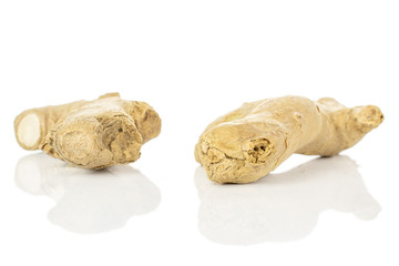 Wall Mural - Group of two whole fresh brown ginger root isolated on white background