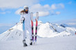 © ZoomTeam - Portrait of beautiful woman with ski and ski suit in winter mountain.