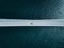 Aerial View Of Bridge Road With Cars Over Lake Or Sea In Finland
