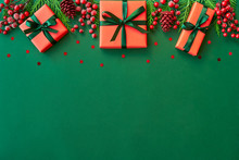 Christmas Flat Lay Background With Fir Tree, Present Box And Decorations On Green. Free Space For Design.	