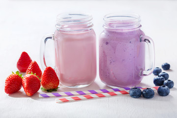 Wall Mural - glass jars of smoothie with fresh berries