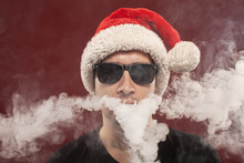 Vaping Man In Santa Claus Hat And A Cloud Of Vapor