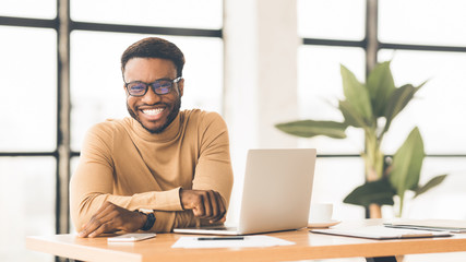 Portrait of handsome black man looking at camera