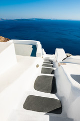  White architecture and blue sea on Santorini island, Greece. Summer holidays, travel destinations concept
