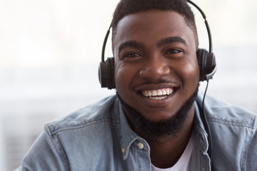 Poster - Portrait of joyful african american call center manager in headset