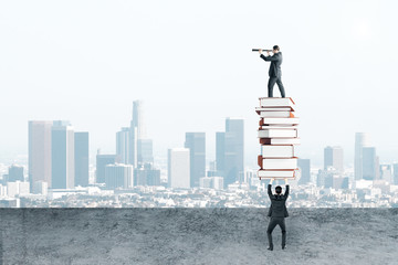 Wall Mural - Businessman holding book pile