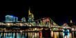 frankfurt skyline at night with colorful reflections in the main river, frankfurt am main, germany