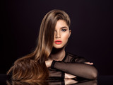 Woman with beauty long brown hair. Beauty woman with living coral color lipstick on lips.