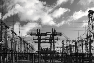  high-voltage  power lines at storm clouds.