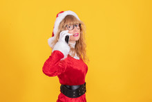Santa Claus Woman With Mobile Phone Isolated On Color Background