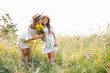 Mother and daughter having fun in the park. Happiness and harmony in family life. Beauty nature scene with family outdoor lifestyle. Mother's Day