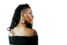 Profile Portrait Of A Young Adult Woman With Bare Shoulders And Dreadlocks Looking To Side