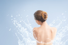 Young Beautiful Woman Portrait With Water Splash