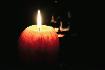 Look at how a single candle can both defy and define the darkness