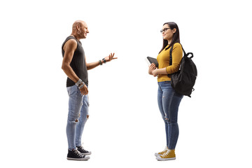 Wall Mural - Male hipster talking to a female student holding books