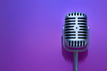 Wall Mural - Retro microphone on color background