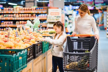 Mother with daughter at a grocery store