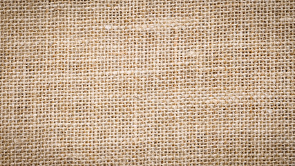 Wall Mural - Cotton woven fabric background with flecks of varying colors of beige and brown. with copy space. office desk concept, Jute hessian sackcloth natura / Hessian sackcloth burlap woven texture background