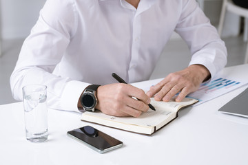 Aufkleber - Hands of successful male entrepreneur in white shirt making working notes
