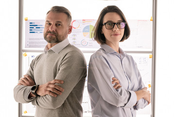 Aufkleber - Two successful economists with crossed arms standing in front of camera