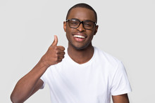 African American Man With Healthy White Smile Showing Thumbs Up