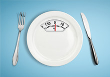 Diet And Weight Loss Concept. Plate With Scale Weighing-machine