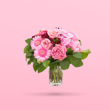Beautiful Bouquet Flowers In Glass Vase Floating On Pink Background, Minimal Design