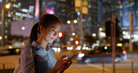 Canvas Print - Woman use of mobile phone in city at night