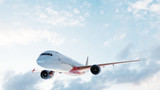 Commercial airplane flying on sunny blue sky.