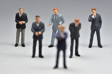 mini business men standing