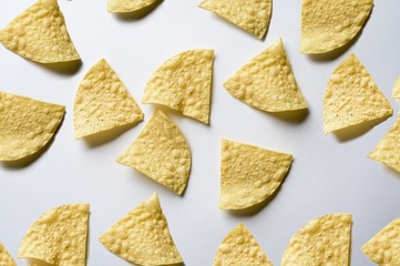 Overhead shot of nachos on a white surface - great for background