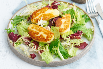 Wall Mural - Cyprus fried halloumi with healthy salad. Lchf, pegan, fodmap, paleo, scd, keto, ketogenic diet. Balanced food, clean eating recipe. Close up, white background, side view