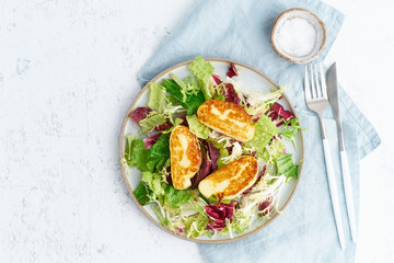 Wall Mural - Cyprus fried halloumi with healthy salad. Lchf, pegan, fodmap, paleo, scd, keto, ketogenic diet. Balanced food, clean eating recipe. Top view, copy space