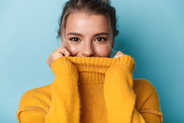 Wall Mural - Portrait of beautiful happy woman looking at camera