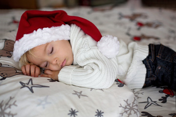 Canvas Print - Sweet beautiful blond toddler boy, sleeping in bed with toy