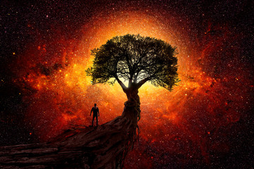 Man under a tree in front of the universe