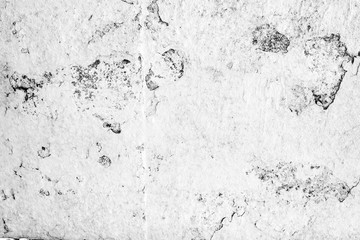 Texture of a concrete wall with cracks and scratches which can be used as a background