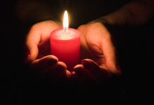  Female Hands Holding A Burning Candle In The Dark